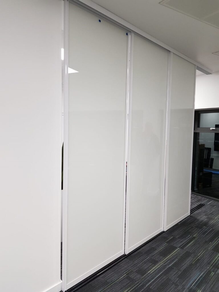 Sliding Whiteboard doors on tracks for F1 Team Fusion Office Design